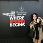 Ellie posing in front of the logo!